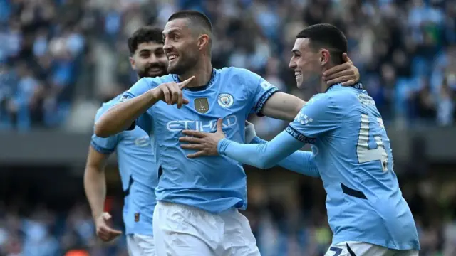 Mateo Kovacic of Manchester City celebrates scoring his team's second goal with teammate Phil Foden during the Premier League match between Manchester City FC and Fulham FC at Etihad Stadium