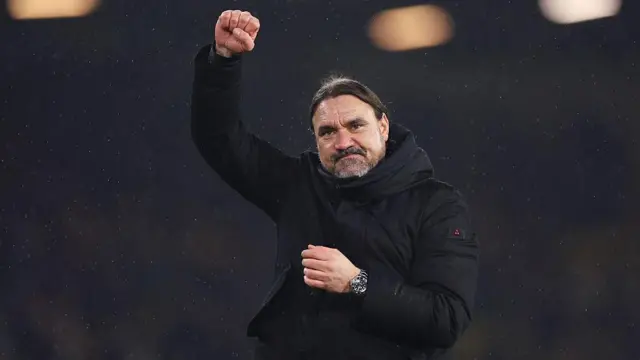 Daniel Farke celebrates with his fist clenched in the air