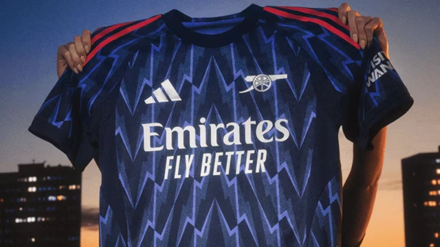 Arsenal's away shirt for the new season is held up 