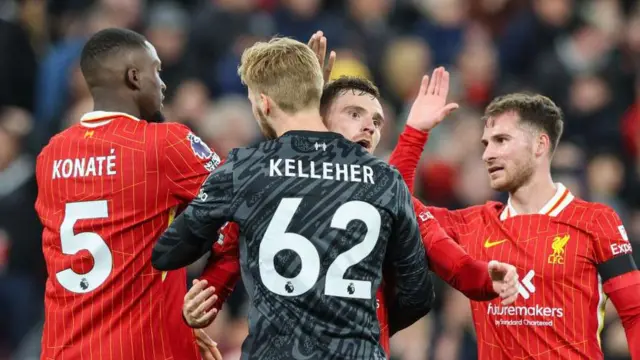 Liverpool players congratulate each other at full time