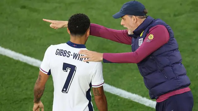 Thomas Tuchel, Head Coach of England, talks to Morgan Gibbs-White