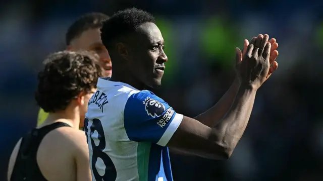 Danny Welbeck applauds fans on the pitch