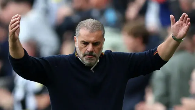 Ange Postecoglou showing his frustration by holding his arms in the air on the touchline