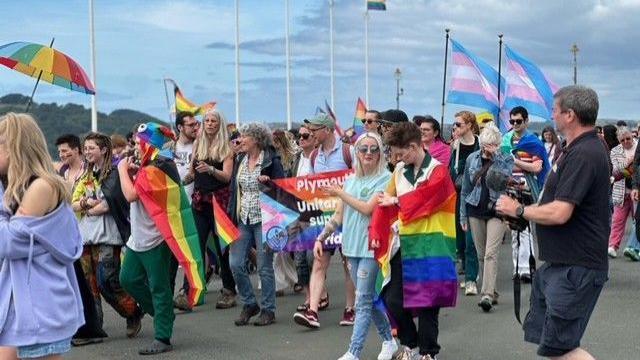 People marching down the Hoe