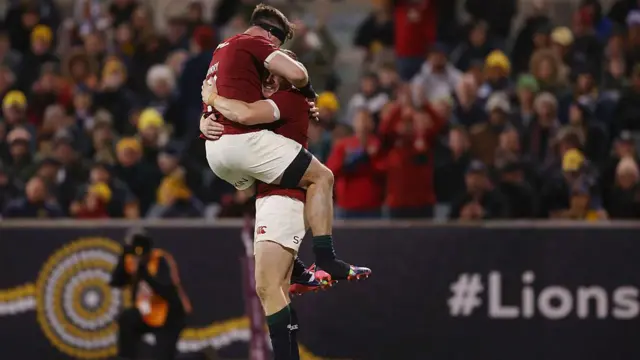 Garry Ringrose jumps on Tom Curry as he celebrates his try
