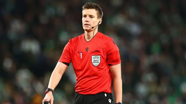 Referee Daniel Siebert officiating Sporting vs Arsenal