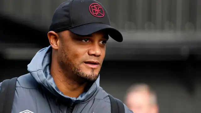 Vincent Kompany enters a football stadium