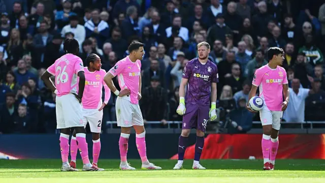Aaron Ramsdale of Southampton looks on alongside teammates.