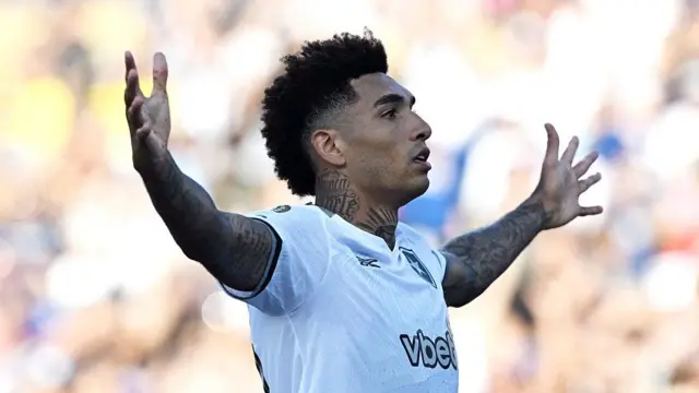 Igor Jesus throws his arms out to celebrate