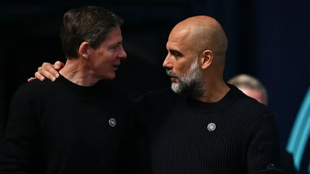 Oliver Glasner and Pep Guardiola embrace