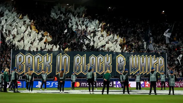 Choreography of flags and a banner reading 'Back in Black & White' from Newcastle fans before the match