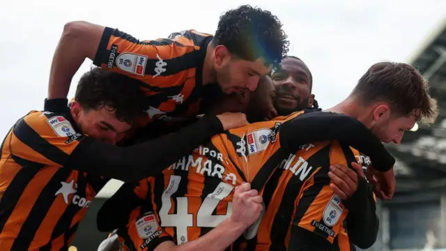 Hull City players celebrate a goal last season 
