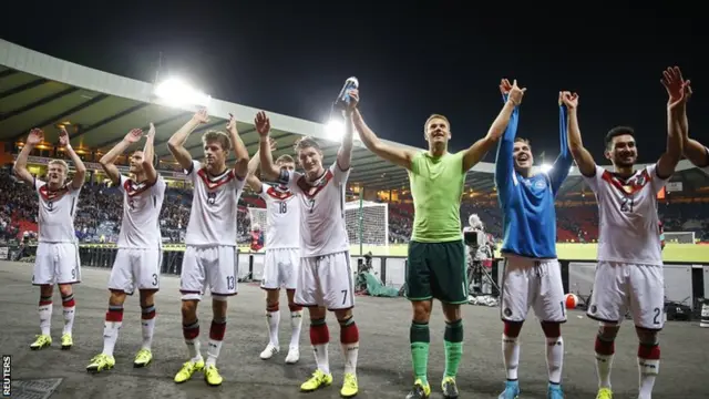 The German players take the acclaim of the away fans