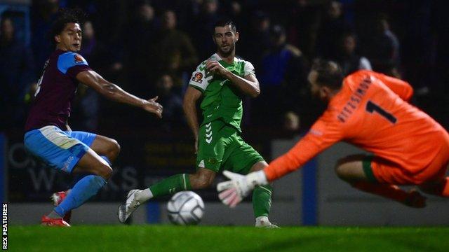 Joe Quigley (centre) in action for Yeovil