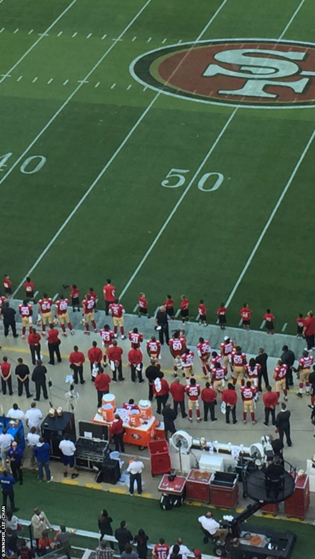 Kaepernick sitting on the bench