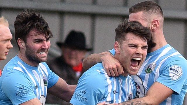 Warrenpoint players celebrate a vital victory over Portadown