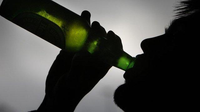 Man drinking beer from a bottle