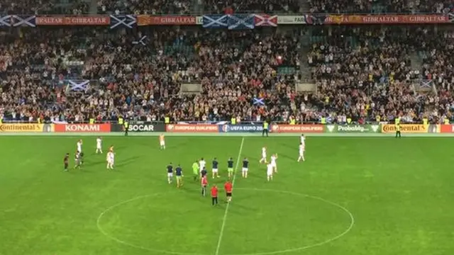 Scotland players salute the Tartan Army