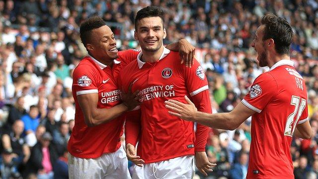 Tony Watt (centre) is congratulated after his second-half goal