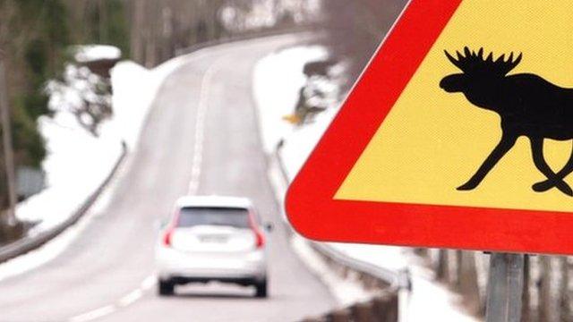 Driverless car and elk sign on Swedish road