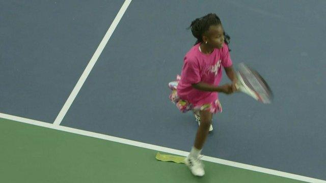 Little girl playing tennis