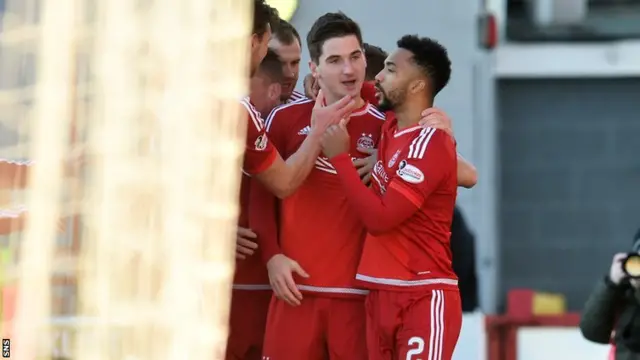 Aberdeen celebrate the opening goal from Kenny McLean (centre)