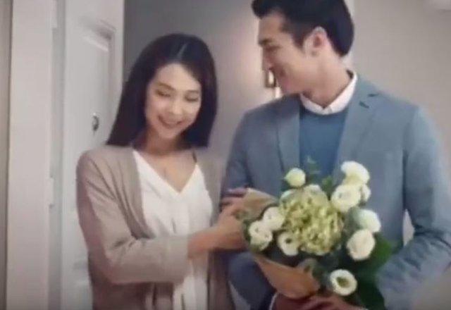 A Chinese woman poses with her boyfriend in a screengrab from the scrapped Chinese Ikea advert