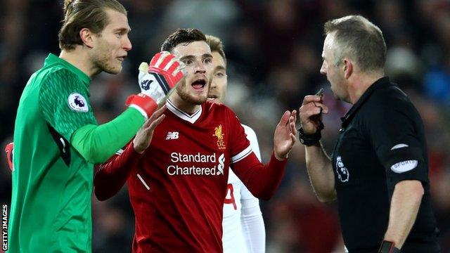 Loris Karius challenges the referee