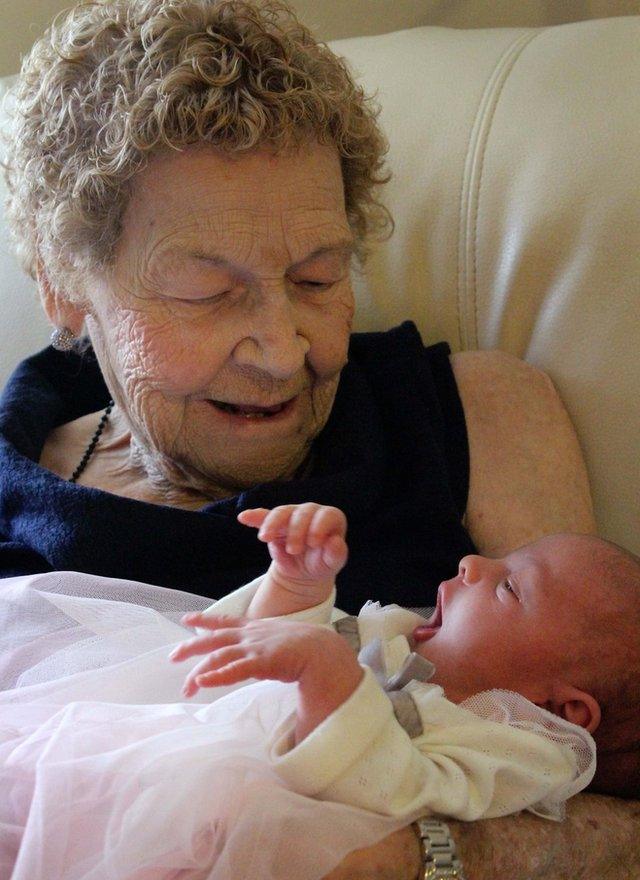 Vera Sommerfeld, 96, of Lethbridge, Canada, is pictured holding her baby great-great-great-grandaughter, Callie Marsh