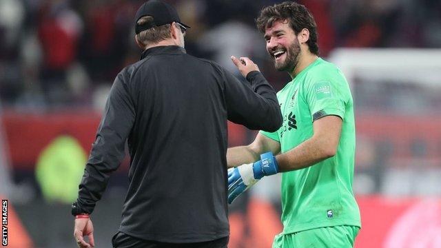 Liverpool keeper Alisson celebrating with Jurgen Klopp