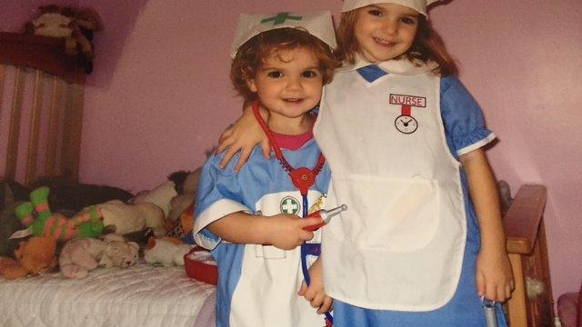 Two sisters dressed up as nurses