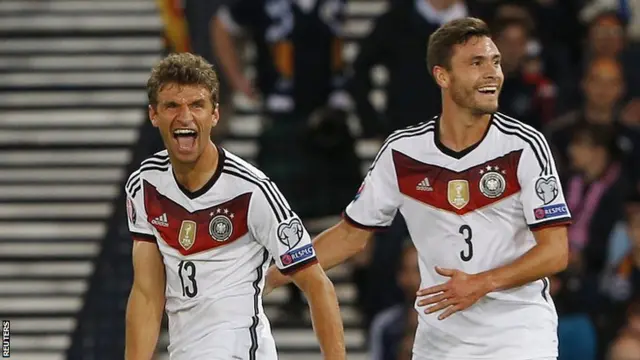 Thomas Muller (left) fired the world champions in front