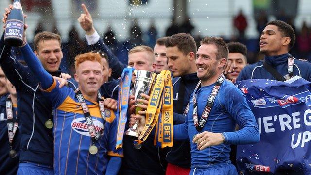 The 2014-15 League Two runners-up Shrewsbury Town celebrate promotion