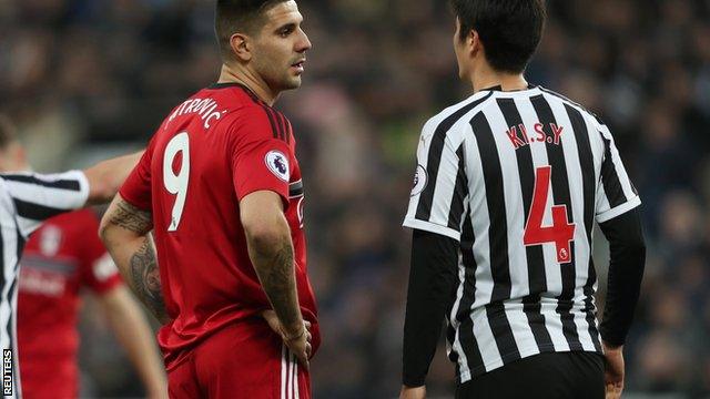 Newcastle and Fulham players react