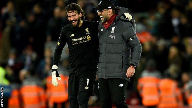 Jurgen Klopp celebrating with Alisson