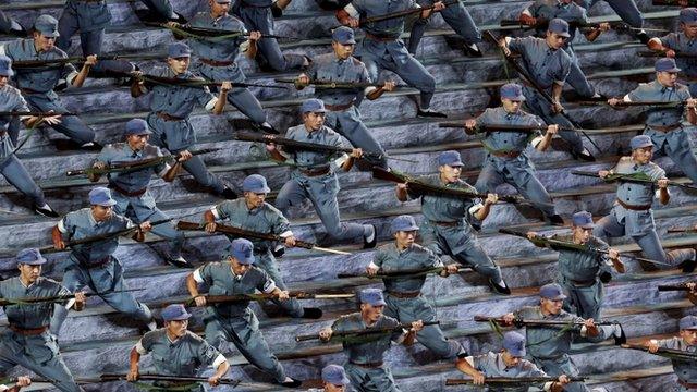 Actors dressed as Chinese soldiers