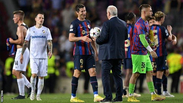 Robert Lewandowski was handed the match ball after scoring a hat-trick for Barcelona against Viktoria Plzen