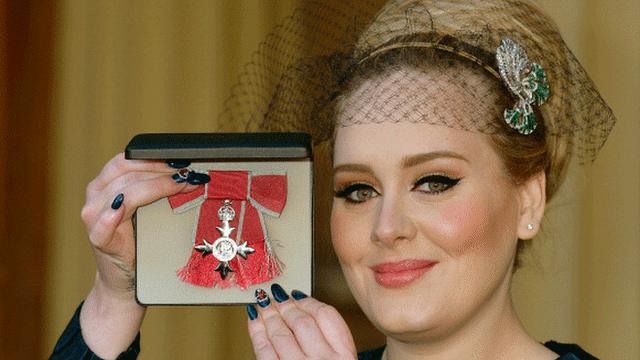 Adele collecting a medal