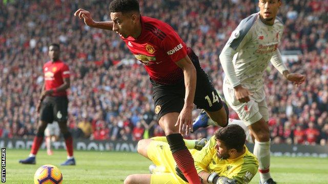 Alisson makes save from Jesse Lingard