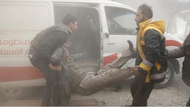 Injured man carried to ambulance after air strike on Douma, in the Eastern Ghouta (7 February 2018)