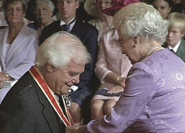 Sir Arnold receiving knighthood in 2004