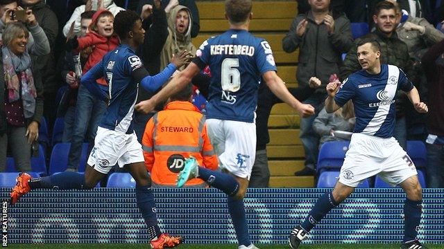 Paul Caddis (right) celebrates his penalty