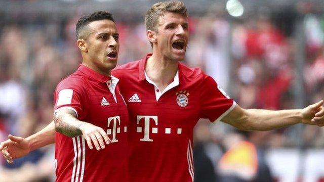 Bayern Munich's Thomas Muller (right) celebrates scoring against Augsburg