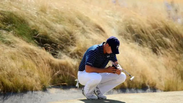 Jordan Spieth waits on the green