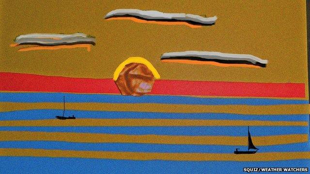 Scene of two boats on water, with the sun on the horizon, made from cut out pieces of paper