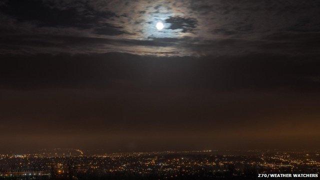 Full moon over a city