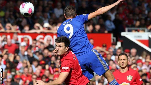 Harry Maguire and Jamie Vardy in an aerial duel