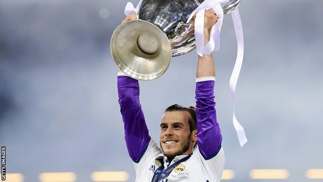 Gareth Bale lifts the Champions League trophy in his home city of Cardiff