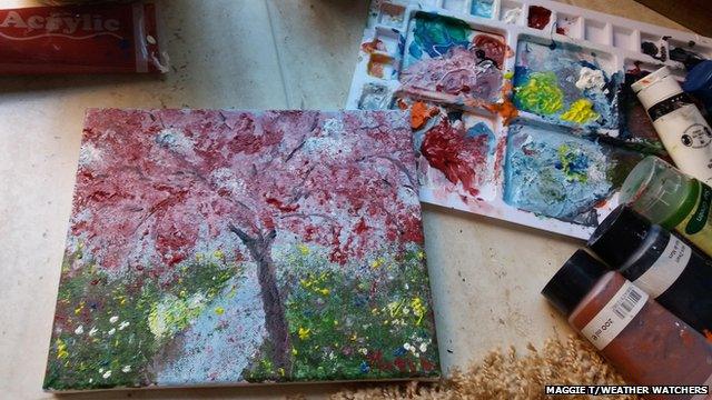 A watercolour of pink blossom on canvas