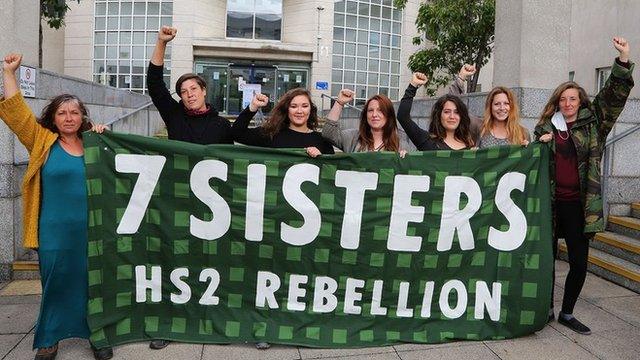 Seven women outside Milton Keynes Magistrates' Court with banner